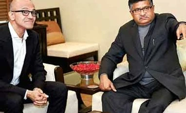 Nadella uses personal phone to iterate Microsoft's productivity Satya Nadella & Ravi Shankar Prasad. File photo