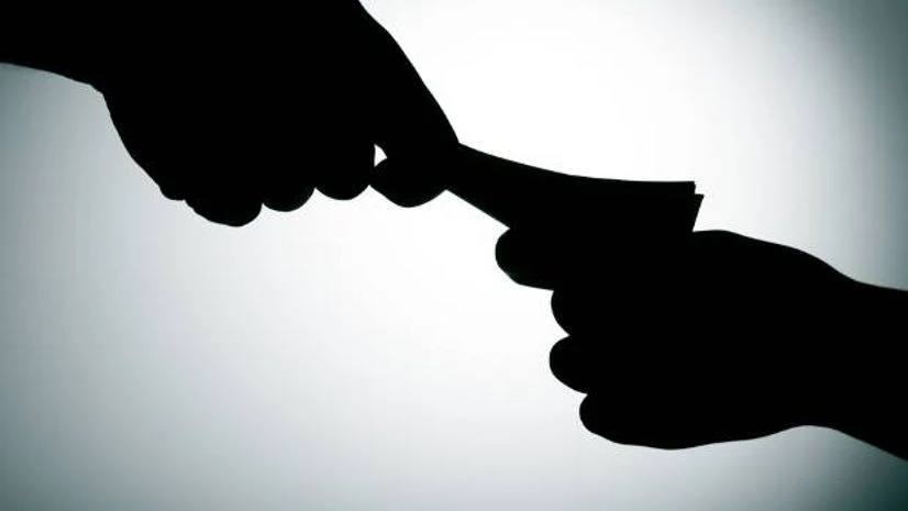 Image via Shutterstock Bribe