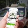 Uber rival Grab to raise $2 bn from SoftBank and China's Didi, reports WSJ