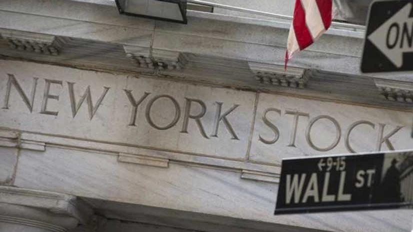 A Wall St. sign is seen outside the entrance of the New York Stock Exchange in New York's financial district A Wall St. sign is seen outside the entrance of the New York Stock Exchange in New York's financial district