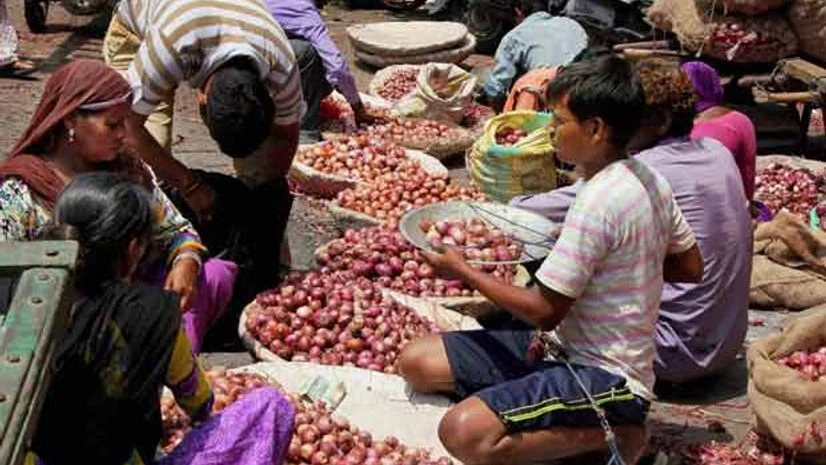 A greengrocer sells onions at Aazadpur Mandi in New Delhi, on Monday, 24 August 2015 Picture by PTI A greengrocer sells onions at Aazadpur Mandi in New Delhi, on Monday, 24 August 2015 Picture by PTI