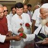 Former Bihar Chief Minister and HAM (S) chief Jitan Ram Manjhi meets with Haj pilgrims at Gaya airport on Thursday, 27 August 2015 <b>Picture by PTI</b>