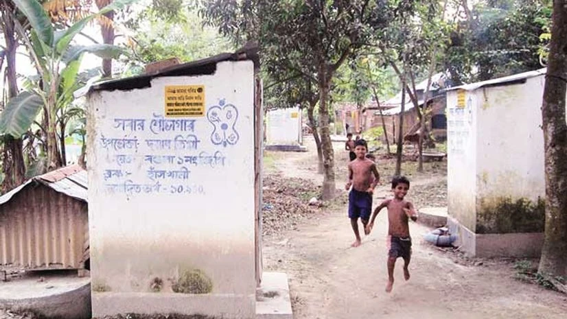 Children run past the toilets built by the state government under the Nirmal Bangla Abhijan in Bagula I in Nadia, West Bengal Children run past the toilets built by the state government under the Nirmal Bangla Abhijan in Bagula I in Nadia, West Bengal