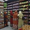 Customers shop inside a retail outlet at a shopping mall in Kolkata