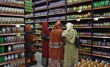 Consumers offer a ray of hope after glum economic data Customers shop inside a retail outlet at a shopping mall in Kolkata