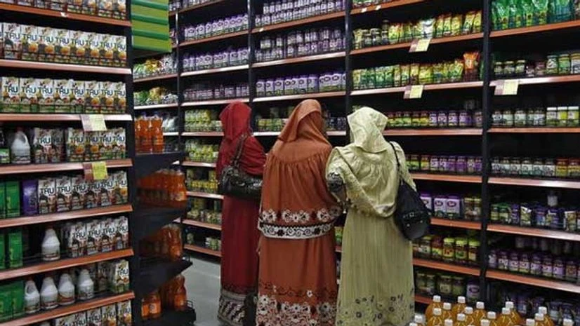 Customers shop inside a retail outlet at a shopping mall in Kolkata Customers shop inside a retail outlet at a shopping mall in Kolkata
