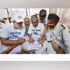 Ex-servicemen who are on hunger strike, reading government's proposal of the implementation of 'One Rank One Pension' (OROP) scheme, at Jantar Mantar in New Delhi on Saturday