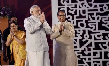 PM Modi, Amit Shah silent on graft charges against BJP govt in MP: Congress File photo of Prime Minister Narendra Modi with External Affairs Minister Sushma Swaraj and Madhya Pradesh Chief Minister Shivraj Singh Chouhan.