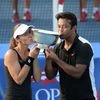 Martina Hingis and Leander Paes kiss the trophy after winning the mixed doubles title at the 2015 US Open. Photo Courtesy: US Open website