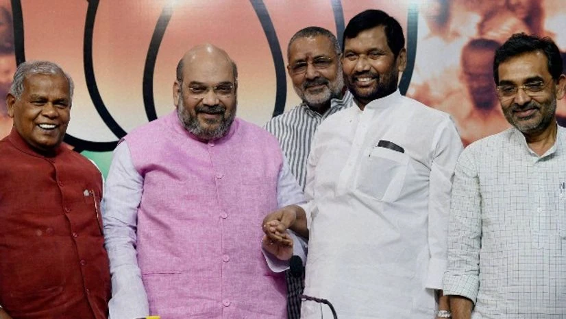 BJP President Amit Shah with HAM(S) chief Jitan Ram Manjhi, LJP President Ramvilas Paswan and RLSP leader Upendra Kushwaha during a press conference regarding Bihar elections, in New Delhi BJP President Amit Shah with HAM(S) chief Jitan Ram Manjhi, LJP President Ramvilas Paswan and RLSP leader Upendra Kushwaha during a press conference regarding Bihar elections, in New Delhi