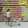 A customer pushes a cart at a supermarket in Fuyang, Anhui province