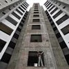 A labourer works at the construction site of a residential complex in Ahmedabad