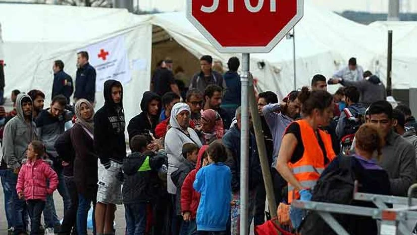 Refugees waiting in Nickelsdorf at the border to Hungary 70 kilometers (43 miles) southeast of Vienna, Austria Monday, Sept. 14, 2015Picture by AP/PTI Refugees waiting in Nickelsdorf at the border to Hungary 70 kilometers (43 miles) southeast of Vienna, Austria Monday, Sept. 14, 2015Picture by AP/PTI