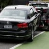 A diesel Volkswagen Passat TDI SEL is taken away by a tow truck for having an expired registration, in Santa Monica, California, United States