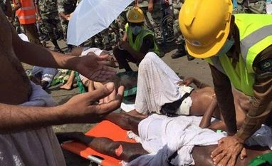 Death toll of Indians in Haj stampede rises to 29 In this image posted on the official Twitter account of the directorate of the Saudi Civil Defense agency, a pilgrim is treated by a medic after a stampede that killed and injured pilgrims in the holy city of Mina during the annual Hajj pilgrimage