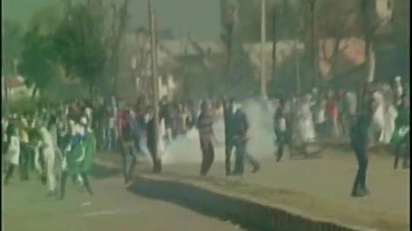 Violence in Srinagar's Eidgah area, security forces fire tear gas shells to disperse protesters. Photo: ANI Kashmir clash
