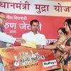 Finance Minister Arun Jaitley handing over loan sanction letter to a MSME entrepreneur during a Mega Credit Campaign organised by Punjab National Bank in New Delhi