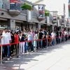 People waiting outside the H &amp;M Store at Select City Walk Mall in New Delhi. Photo: Dalip Kumar