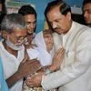 Tourism Minister Mahesh Sharma meeting the family of Ikhlaq, who was beaten to death by a mob, at Bisara in Dadri