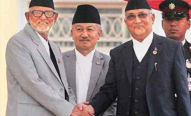 Oli sworn in Nepal PM, faces challenge of tackling protests Nepal's new PM Khadga Prasad Oli (right) and his predecessor Sushil Koirala(left) after Oli took the oath of office