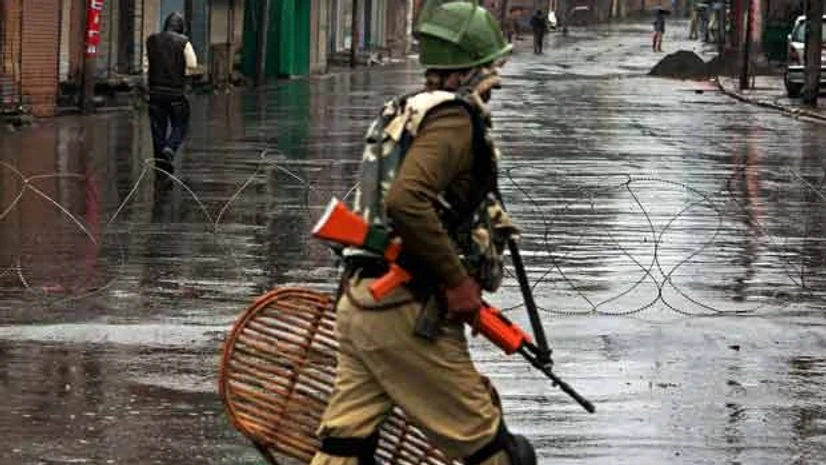 A security personnel stands guard during a bandh in Kashmir A security personnel stands guard during a bandh in Kashmir