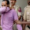 Uber cab driver Shiv Kumar Yadav convicted by Delhi court of raping a 25-year-old woman in his taxi being taken by police in New Delhi