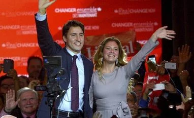 Narendra Modi congratulates new Canadian PM Justin Trudeau New Canadian PM Justin Trudeau waves with his wife Sophie Gregoire at the Liberal party headquarters in Montreal, Tuesday, Oct 20, 2015. Photo via AP/PTI