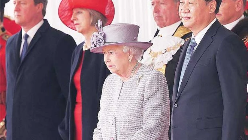 Britain's Queen Elizabeth (second from right) and Prime Minister David Cameron (left) stand with China's President Xi Jinping (right) during a ceremonial welcome at Horse Guards Parade in London Britain's Queen Elizabeth (second from right) and Prime Minister David Cameron (left) stand with China's President Xi Jinping (right) during a ceremonial welcome at Horse Guards Parade in London