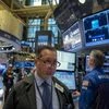 Traders work on the floor of the New York Stock Exchange