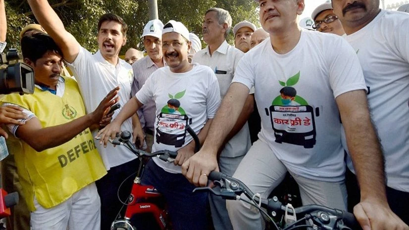 Delhi Chief Minister Arvind Kejriwal and Dy CM Manish Sisodia participates in a cycle-rally from Red Fort to Bhagwan Das Marg to observe 'Car-Free Day' in New Delhi on Thursday. Delhi Chief Minister Arvind Kejriwal and Dy CM Manish Sisodia participates in a cycle-rally from Red Fort to Bhagwan Das Marg to observe 'Car-Free Day' in New Delhi on Thursday.