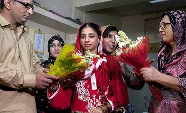 Geeta leaves Pakistan for home, family in India Faisal Edhi (L) of Edhi Foundation presents a bouquet to Indian national Geeta prior her departure from Karachi, on Oct 26, 2015. Geeta, who is deaf and mute, accidentally crossed the border into Pakistan from India as a child nearly 12 yrs ago