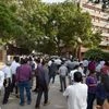 Employees come out of their offices after an earthquake scare in New Delhi