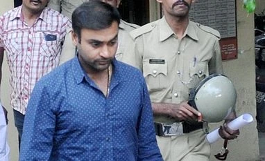 Spinner Amit Mishra held, gets bail in assault case Cricketer Amit Mishra comes out from the Cubbon park Police Station after he got bail in connection with a complaint of assault filed by a woman, in Bengaluru