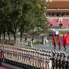 Chinese Premier Li Keqiang, left, walks with German Chancellor Angela Merkel during a welcome ceremony held outside the Great Hall of the People in Beijing, China, Thursday, Oct. 29, 2015.