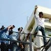 Bollywood actor Shahrukh Khan addresses his fans on his 50th birthday celebration outside his residence, Mannat in Mumbai on Monday, November 2, 2015 PTI Picture