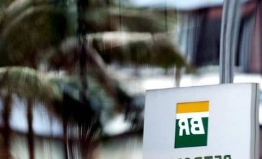 US Justice Dept opens probe into Petrobras bribery case in Brazil The Petrobras logo is reflected in the window of the company's headquarters in Sao Paulo. Photo: Reuters