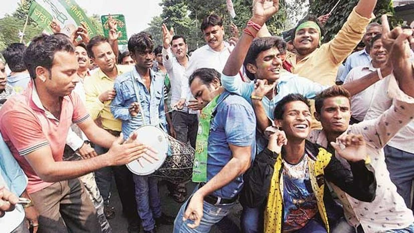 Supporters celebrating the grand alliance's victory in Bihar Assembly elections in Patna on Sunday Supporters celebrating the grand alliance's victory in Bihar Assembly elections in Patna on Sunday