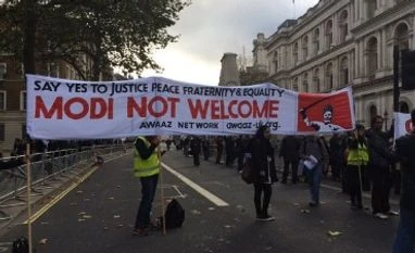 Trade deals, protests mark UK visit by India's PM Modi Hundreds protest against Modi's UK visit