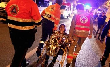 Paris attacks: Facebook activates 'safety check' for Paris users A person is being evacuated after a shooting, outside the Bataclan theater in Paris, France. Photo: AP/PTI