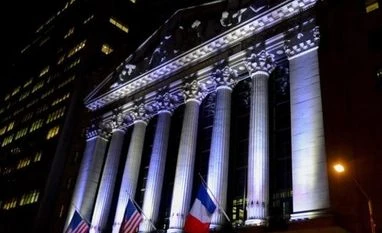 Global markets brace for short-term hit after Paris attacks The New York Stock Exchange flies a French flag, in New York, November 14, 2015, following the deadly attacks in Paris