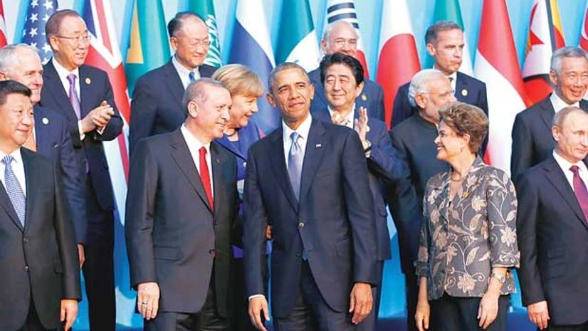 Members of the Group of 20 (G20) Members of the Group of 20 (G20) prepare for the traditional family photo during the G20 leaders summit in the Mediterranean resort city of Antalya in Turkey, on Sunday