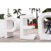 A resident carries his child past an Asia-Pacific Economic Cooperation (APEC) sign in Manila. Photo: Reuters