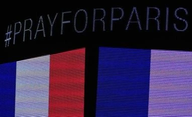 Euro slips after Paris attacks as yen and Swiss franc sought During a moment of silence a message on the scoreboard to honor the tragedy in Paris before the game between the Chicago Blackhawks and the Calgary Flames at the United Center