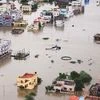 A Coast Guard chopper flies over an inundated area near Chennai on Tuesday