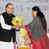 Union Finance Minister Arun Jaitley being welcomed by Rajasthan Chief Minister Vasundhara Raje during the opening ceremony of Resurgent Rajasthan Partnership Summit 2015, in Jaipur. (Photo: PTI)