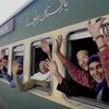 Sikh pilgrims wave from a train as they leave for Gurdwara Nankana Sahib in Pakistan to celebrate the 547th birth anniversary of Sri Guru Nanak Dev, at the Attari Railway Station. (Photo: PTI)