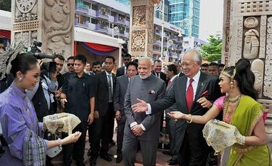 India has ended regulatory uncertainty: Modi Kuala Lumpur: Prime Minister Narendra Modi and his Malaysian Counterpart Najib Razak during the inaugural ceremony of Torana Gate in Kuala Lumpur, Malaysia on Monday . PTI Photo