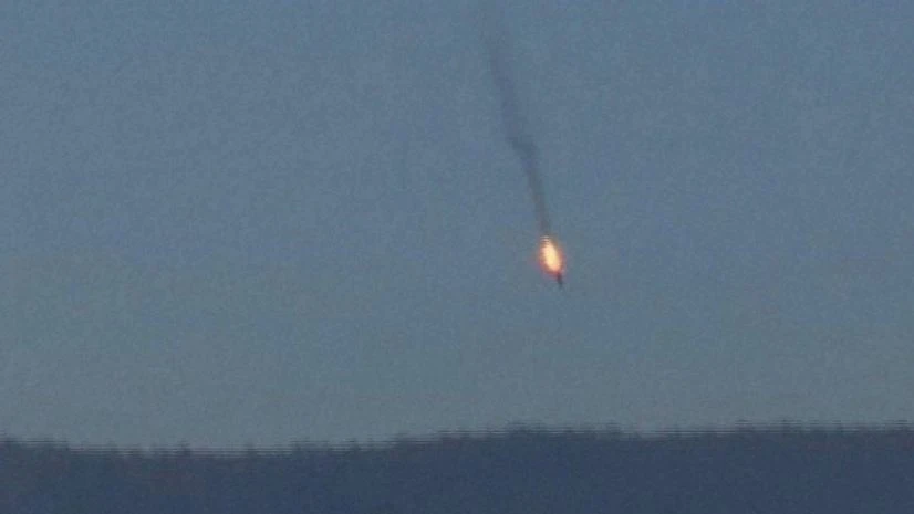 This frame grab from video by Haberturk TV, shows a Russian warplane on fire before crashing on a hill as seen from Hatay province, Turkey This frame grab from video by Haberturk TV, shows a Russian warplane on fire before crashing on a hill as seen from Hatay province, Turkey