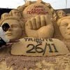 Sand sculptor Sudarshan Patnaik making memorial for paying tribute to Mumbai terror attack 2008 victims
