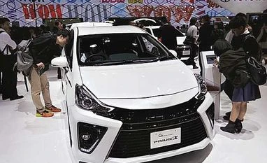 Toyota's US robotics boss promises results within 5 years Visitors look at Toyota Motor Corp’s G’s Prius Alpha at the 44th Tokyo Motor Show in Tokyo